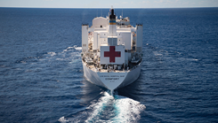 The hospital ship USNS Comfort (T-AH 20) steams through the ocean