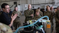 Senior leaders from the U.S. Navy, Air Force, and Army listening to briefs