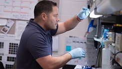 Military medical personnel in lab