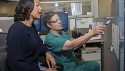 Zekelia Rembert and Anna Moore, virtual health nurse care coordinators, coordinate virtual health projects and outline participating military hospitals and clinics at the Virtual Medical Center in Fort Sam Houston, Texas, on May 16, 2019. Virtual health nurse care coordinators train nurses at varying military hospitals and clinics while providing each nurse with 3.5 hours of continued education. Moore created the program. (Photo by Jason W. Edwards, U.S. Army) 