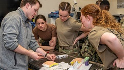 Second-year medical students at the Uniformed Services University hone their surgical techniques during a hands-on session in the surgical skills lab