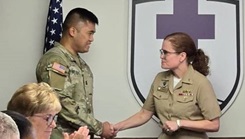 Military personnel shaking hands