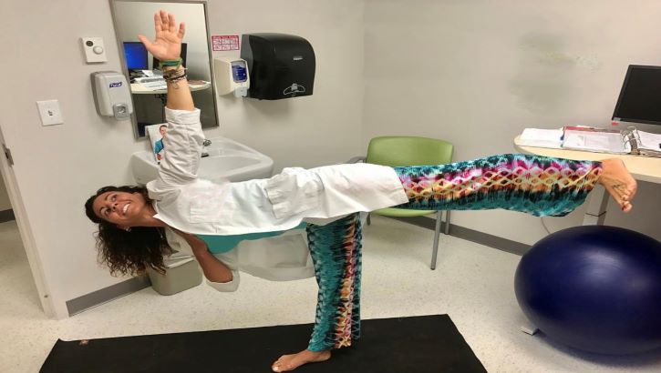 Image of Military personnel in a yoga pose.