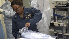 U.S. Navy Seaman 1st Class Cassandra Styles participates in a mass casualty drill