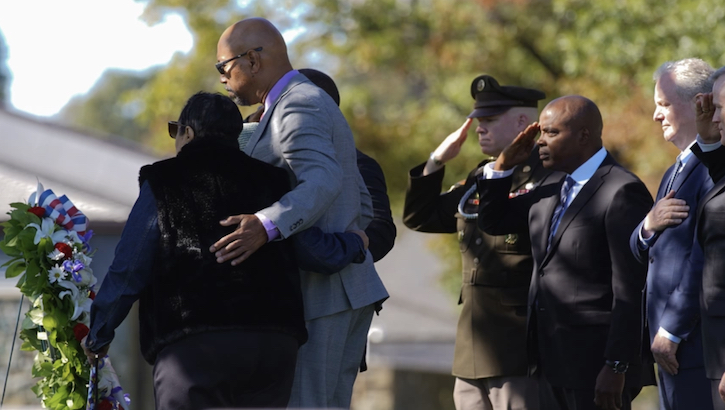 Image of Family members and key speakers honor World War II medic U.S. Army Cpl. Waverly Woodson.