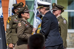 The passing of the unit colors takes place during at transfer of directorship ceremony held at the Alexander T. Augusta Military Medical Center at Fort Belvoir on July 5. Pictured from the left are U.S. Army Col. Elba Villacorta, the new director of the ATAMMC, U.S. Navy Rear Adm. Anne Swap, former director of the National Capital Medical Directorate, and U.S. Army Col. Kathy Spangler, outgoing director of the ATAMMC.