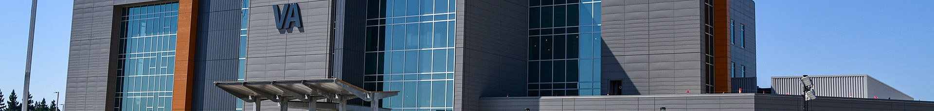 A construction crew with the U.S. Army Corps of Engineers Sacramento District works in front of the new VA Stockton Community Based Outpatient Clinic in Stockton, California, on August 7, 2023. District crews have nearly finished the exterior of both the clinic and an on-site central utilities plant, and are planning to turn both facilities over to the VA Northern California Health Care System in early 2024. The clinic will provide a wide array of services to Central Valley veterans including primary care, mental health care, and prosthetics.