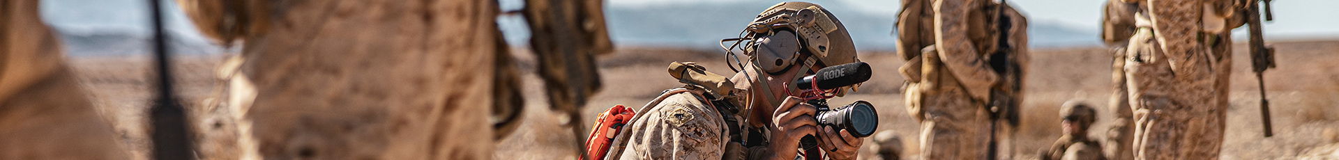 U.S. Marine Corps Cpl. Damian Oso, a Sanford, Maine native, combat videographer with Communication Strategy and Operations, Headquarters Battalion, Marine Air-Ground Task Force Training Command, Marine Corps Air-Ground Combat Center, center, records video footage during a 7th Marine Regiment Infantry Rifle Squad Competition at Range 410, MCAGCC, Twentynine Palms, California, Dec. 18, 2024. The 7th Marine Regiment Infantry Rifle Squad Competition assesses tactical proficiency and determines the Regiment's most capable squad under simulated combat conditions. Designed to evaluate tactics, techniques, and procedures, the event also promotes professional growth and camaraderie through healthy competition. (U.S. Marine Corps photo by Lance Cpl. Enge You)