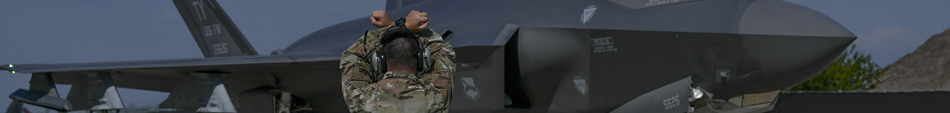 A U.S. Air Force Airman signals to an F-35A Lightning II pilot at Tyndall Air Force Base, Florida, Aug. 1, 2023. The aircraft are the first of more than 70 F-35s slated to arrive to the 325th Fighter Wing fleet, filling three projected squadrons as Tyndall simultaneously rebuilds into the “Installation of the Future.” (U.S. Air Force photo by Airman Zeeshan Naeem)