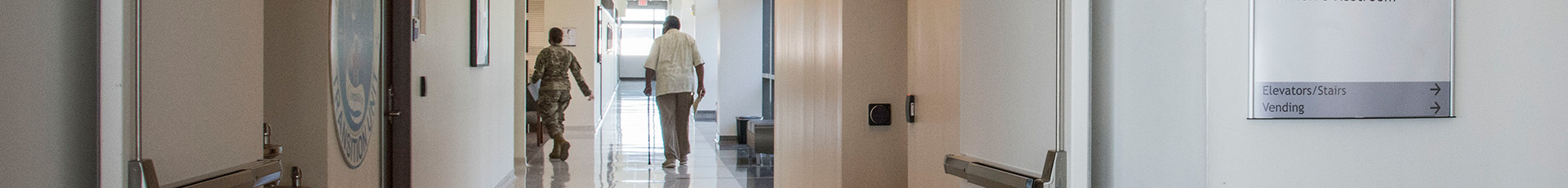 A patient walks down A-wing to TRICARE Operations and Patient Administration on the third floor of Wilford Hall Ambulatory Surgical Center, Joint Base San Antonio-Lackland, Texas, March 25, 2021. TOPA creates, maintains and quality checks all written medical records, and handles medical examination boards. (U.S. Air Force photo by Airman 1st Class Melody Bordeaux)