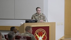 Military personnel at podium