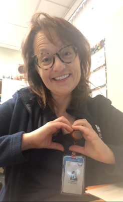 Nurse holding up a heart